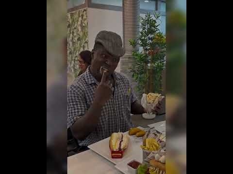 Napi enjoying his self at restaurant Madrid Spain.African comedy